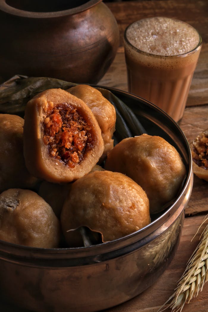 Delicious modaks with a cup of masala chai, a treat for Indian festivals.